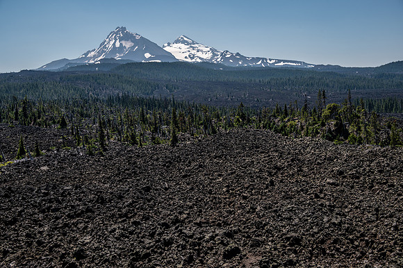 Sisters behind Belknap Lava Field